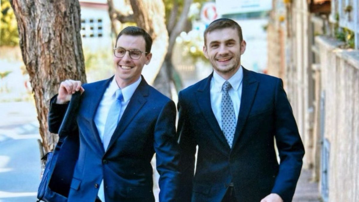 Yakir Hexter (on right) walks with his best friend, Dovid Schwartz, to a wedding. Both men, who were 26, died together Jan. 8 in a grenade attack during intense fighting in southern Gaza.  
